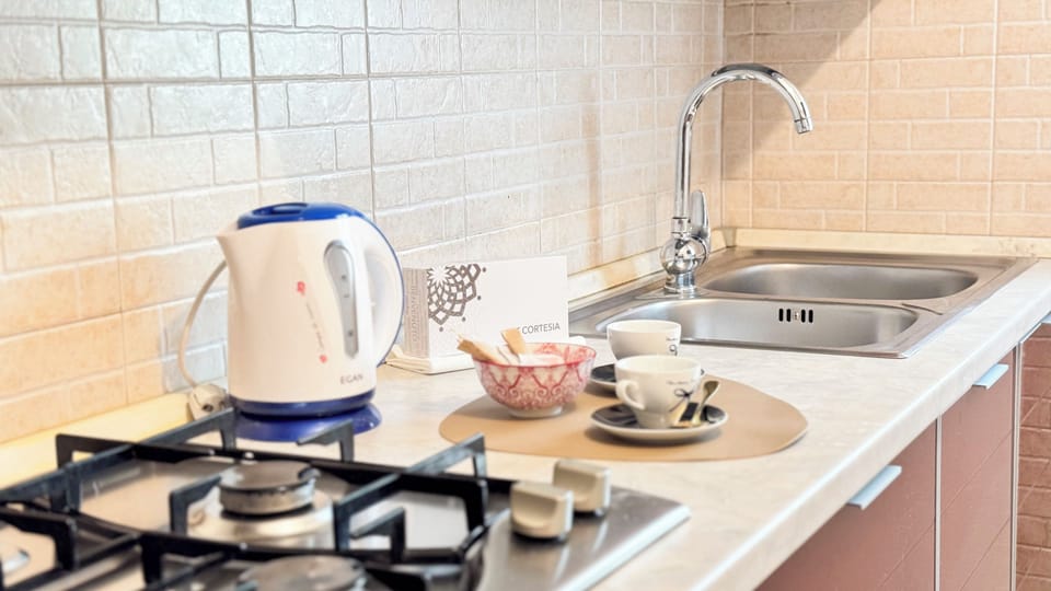 Apartment (1 Bedroom) | Private kitchen | Espresso maker, electric kettle, highchair, cookware/dishes/utensils