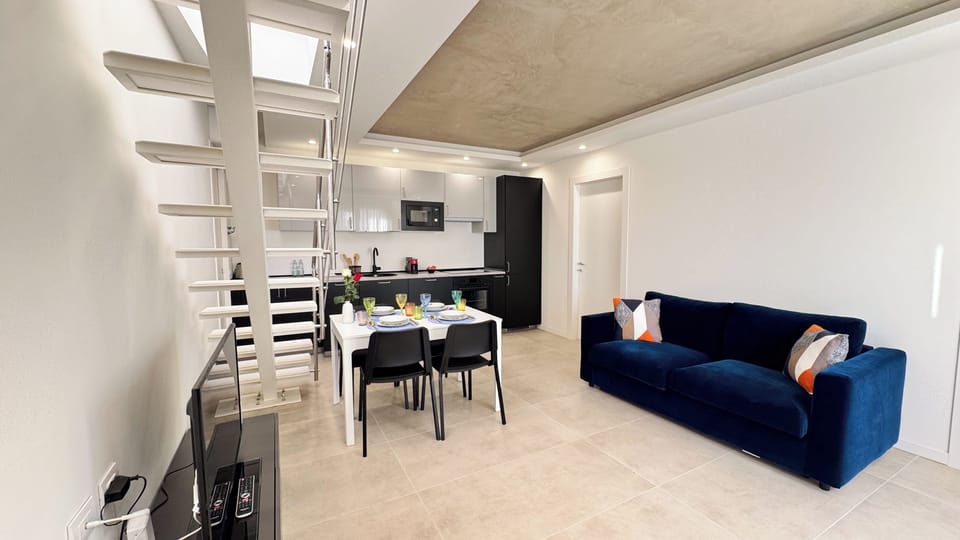 Apartment (2 Bedrooms) | Living area | 32-inch Smart TV with cable channels