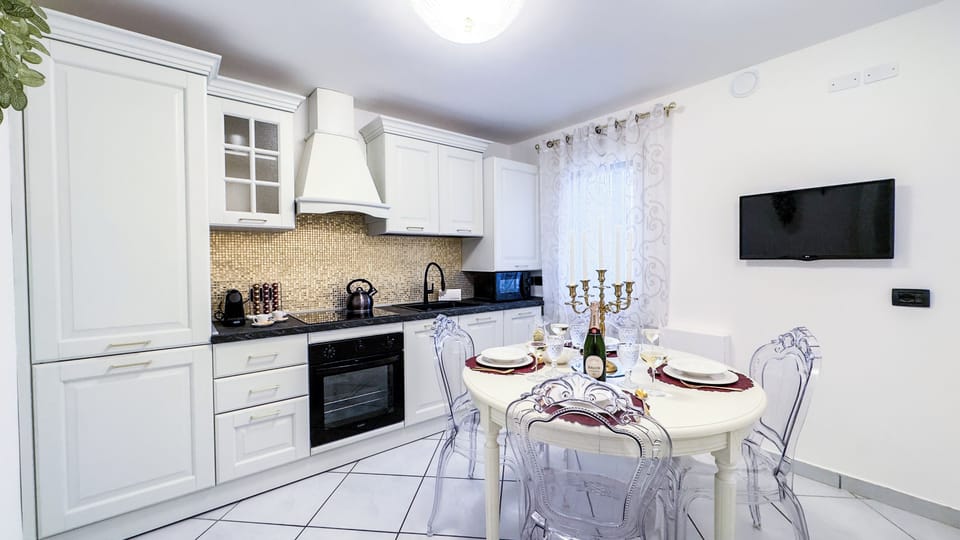 Apartment (2 Bedrooms) | Private kitchen | Espresso maker, microwave, electric kettle, highchair