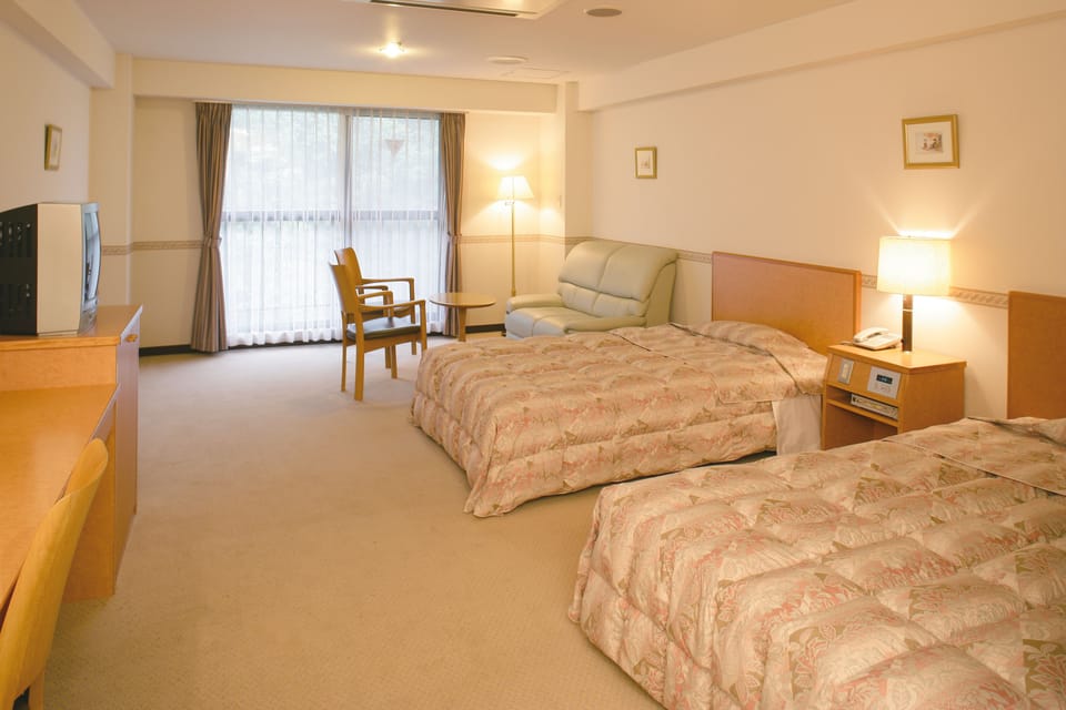 Twin Room, Half board, Non Smoking | Premium bedding, in-room safe, desk, iron/ironing board