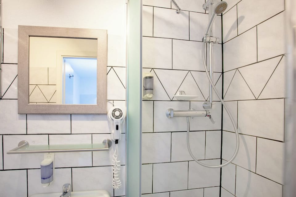 Economy Twin Room | Bathroom | Hair dryer, towels, toilet paper