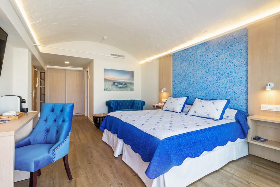 Deluxe Double Room, Terrace, Partial Sea View | Pillowtop beds, in-room safe, desk, laptop workspace