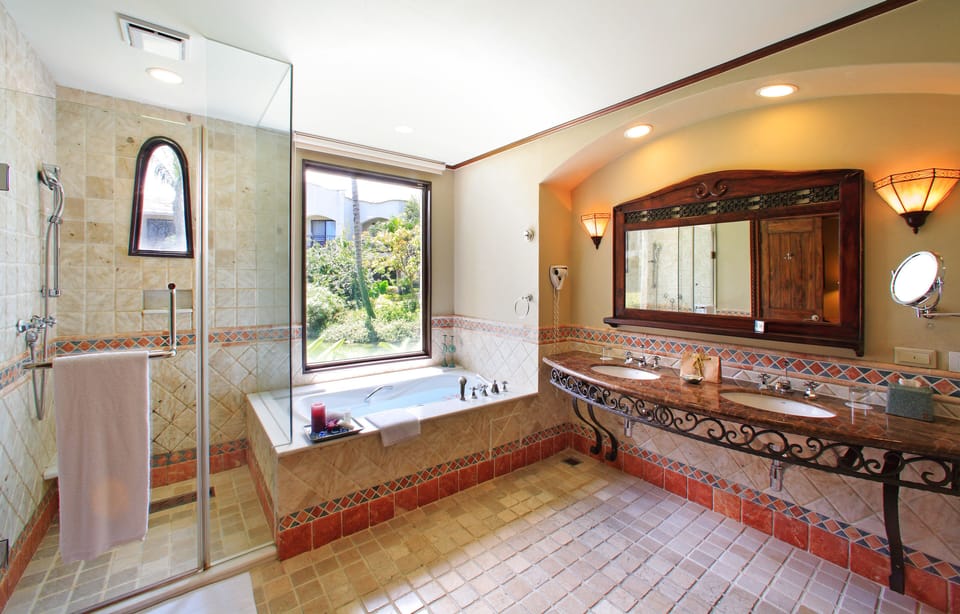 Separate tub and shower, rainfall showerhead, free toiletries