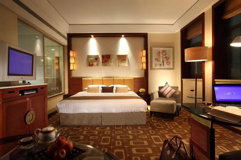 Deluxe Room, City View | Minibar, in-room safe, desk, laptop workspace