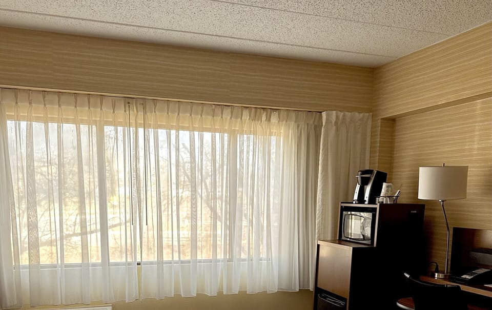 Desk, blackout drapes, iron/ironing board, free cribs/infant beds