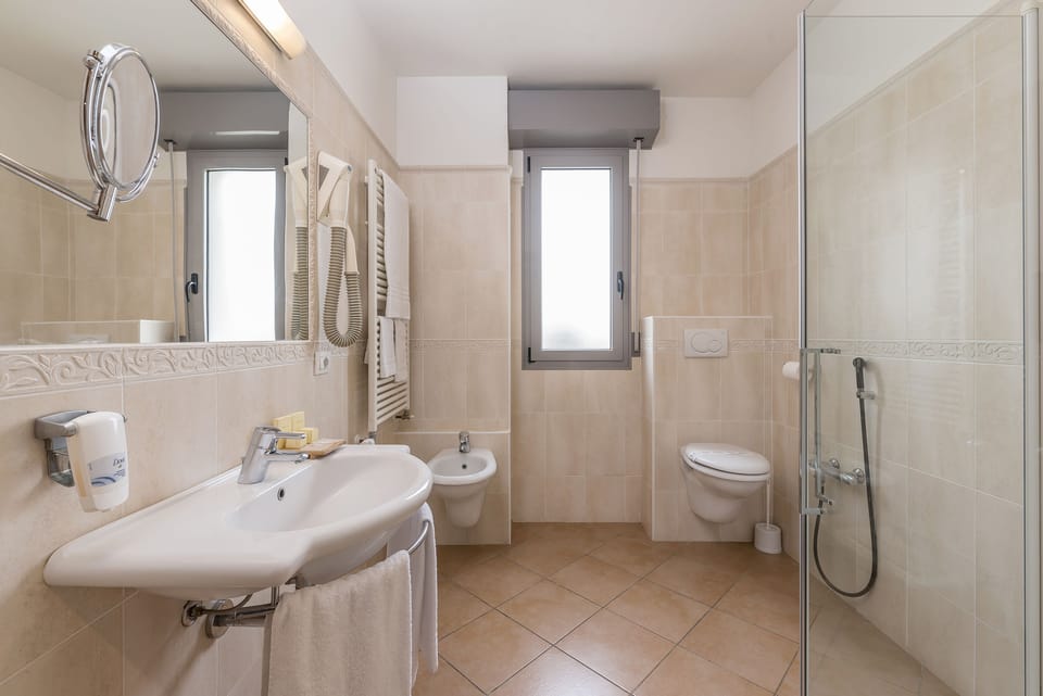 Eco-friendly toiletries, hair dryer, bathrobes, slippers