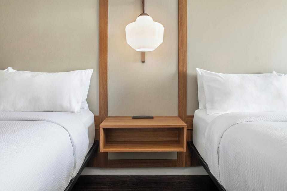Deluxe Room, 2 Queen Beds | Hypo-allergenic bedding, in-room safe, desk, blackout drapes