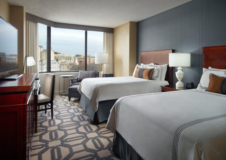 Premium bedding, down comforters, pillowtop beds, in-room safe