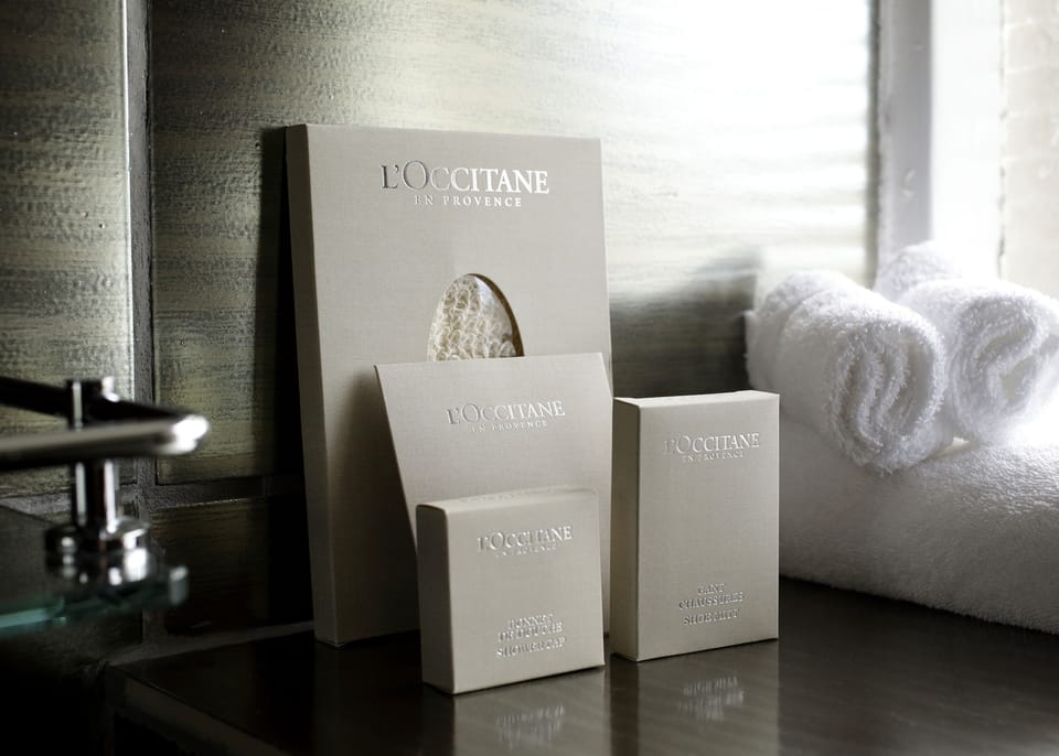 Designer toiletries, hair dryer, bathrobes, slippers