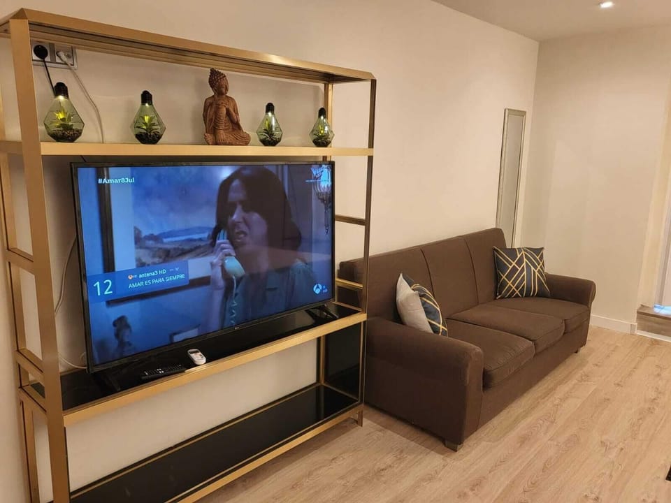 Family Studio Suite | Living area | 26-inch flat-screen TV with digital channels, TV