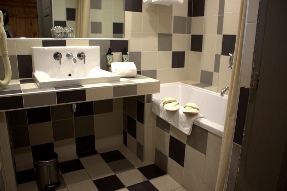 Family Duplex Suite | Bathroom | Hair dryer, slippers, towels