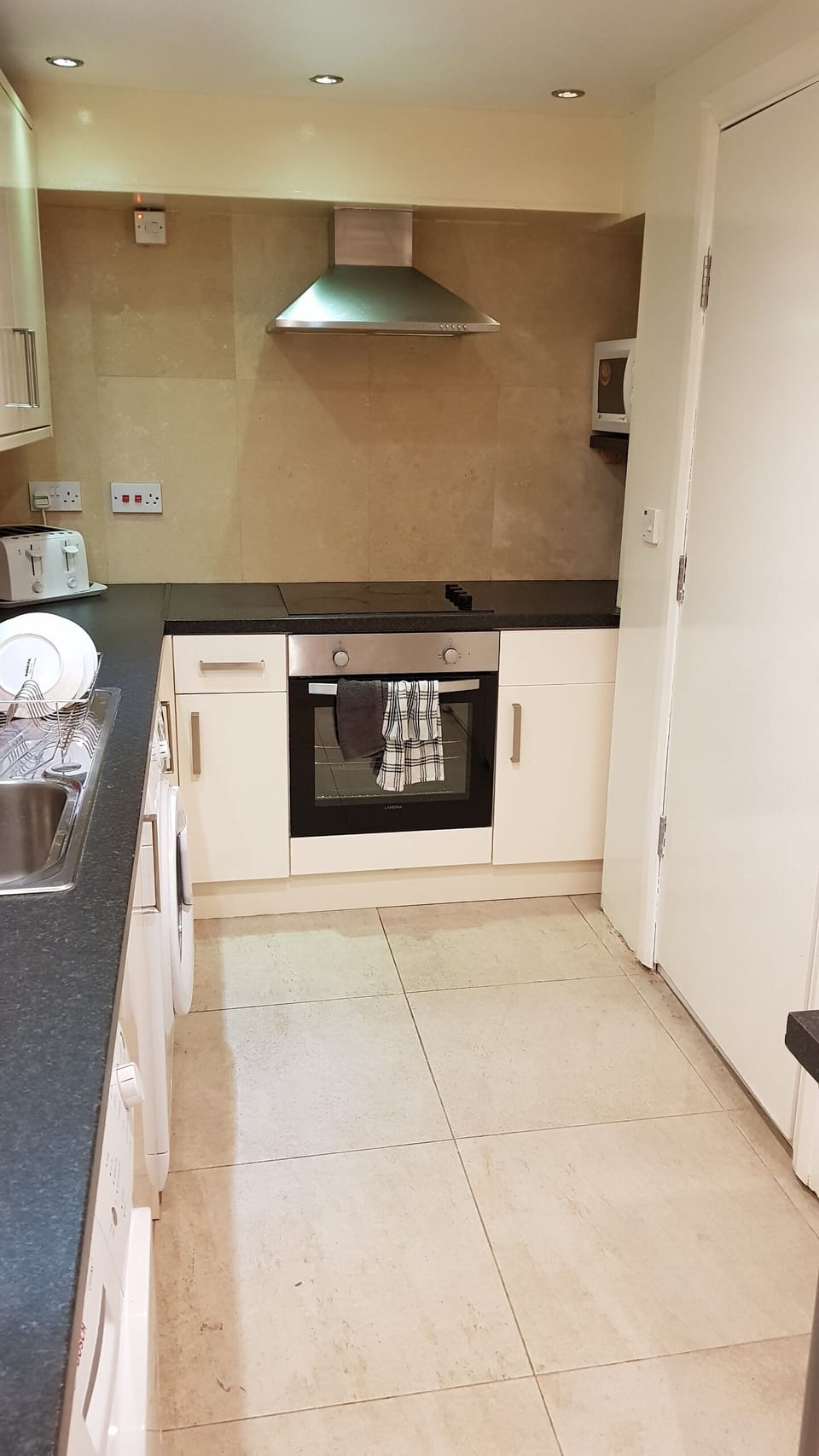 Fridge, microwave, coffee/tea maker, cookware/dishes/utensils