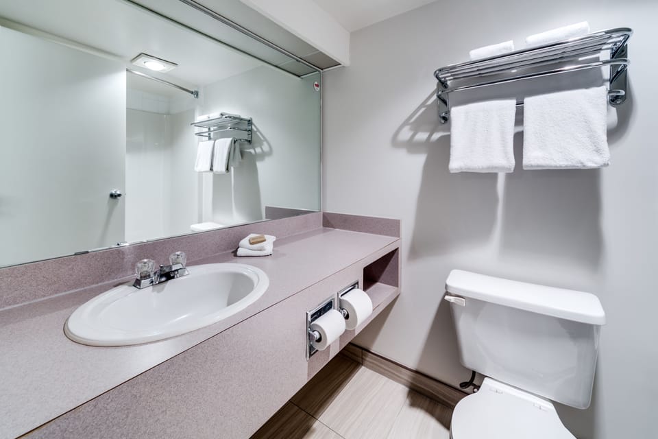 Combined shower/tub, hair dryer, towels, soap