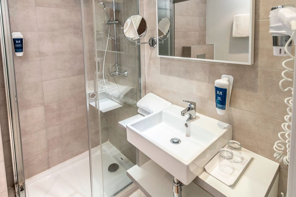Shower, free toiletries, hair dryer, towels