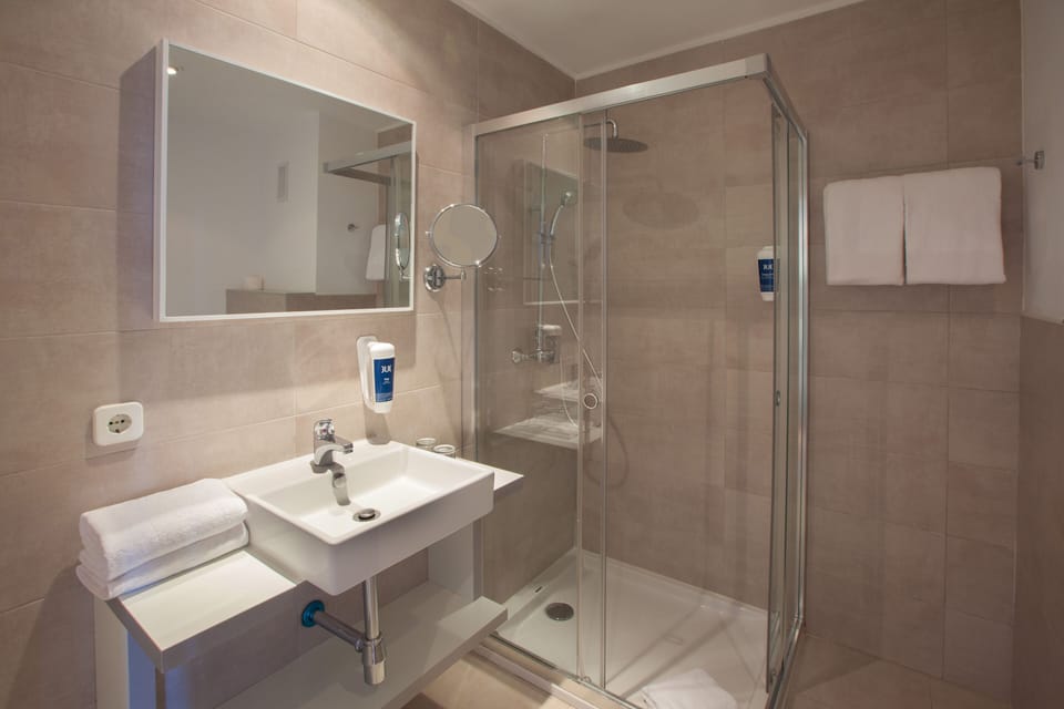Shower, free toiletries, hair dryer, towels