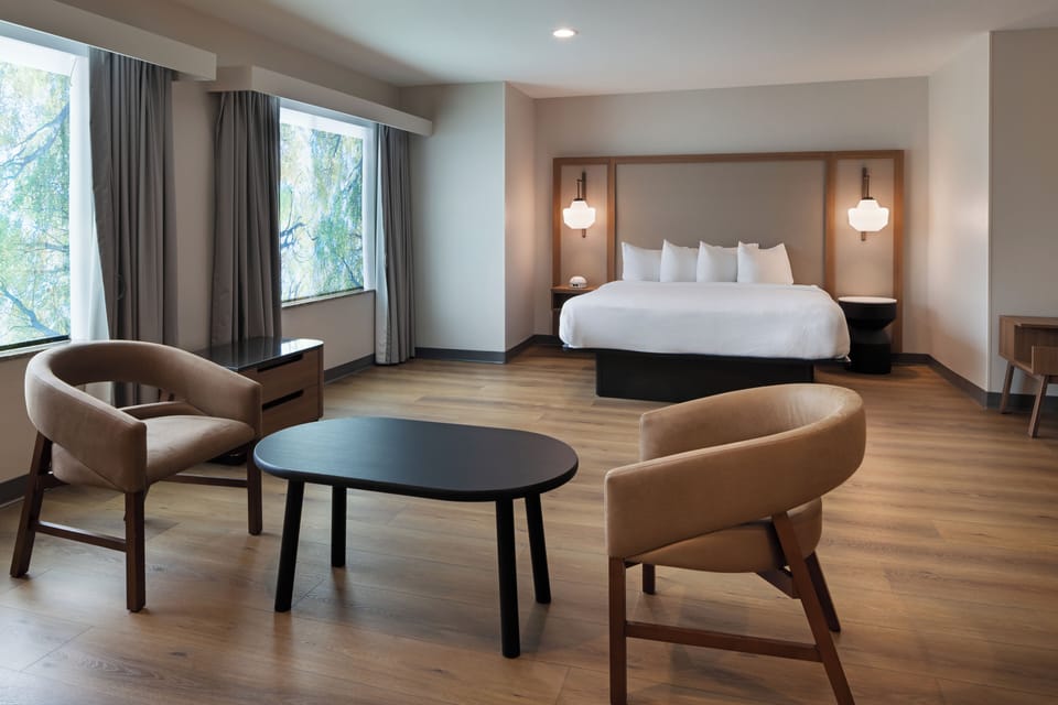 Premium bedding, desk, laptop workspace, iron/ironing board