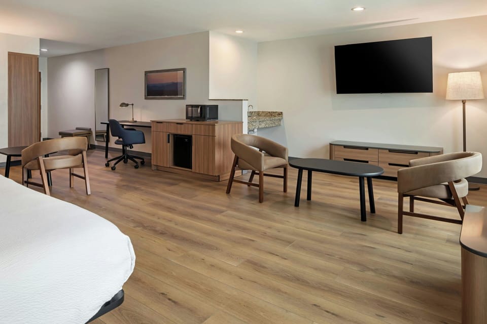 Premium bedding, desk, laptop workspace, iron/ironing board