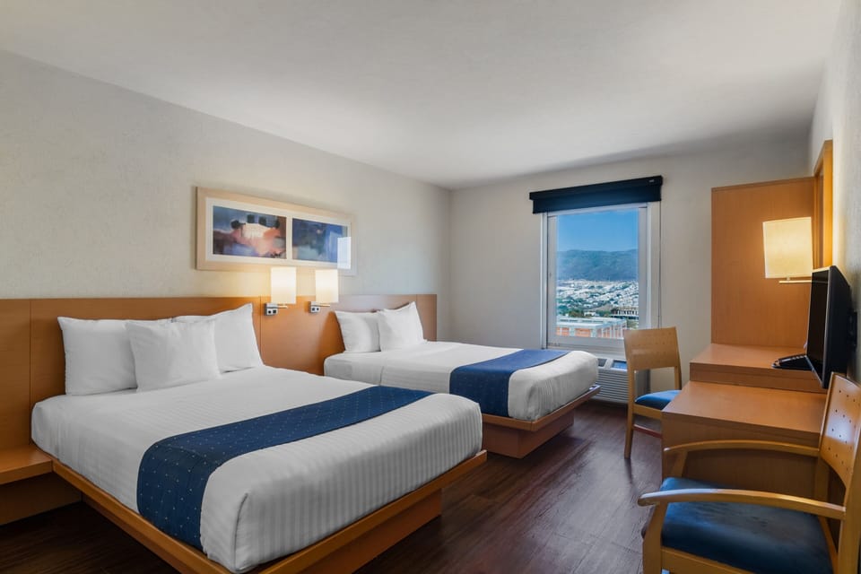 Room, 2 Double Beds | Down comforters, desk, blackout drapes, iron/ironing board