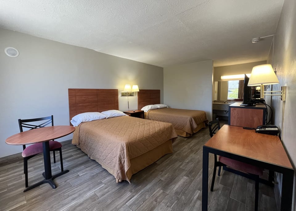 Deluxe Room, 2 Double Beds, Non Smoking | Desk, laptop workspace, blackout drapes, iron/ironing board