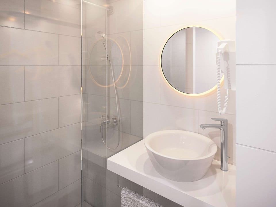 Shower, eco-friendly toiletries, hair dryer, towels