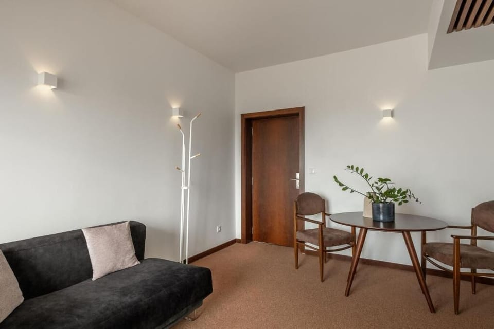 Superior Double Room, Balcony | Living area | 50-cm TV with cable channels