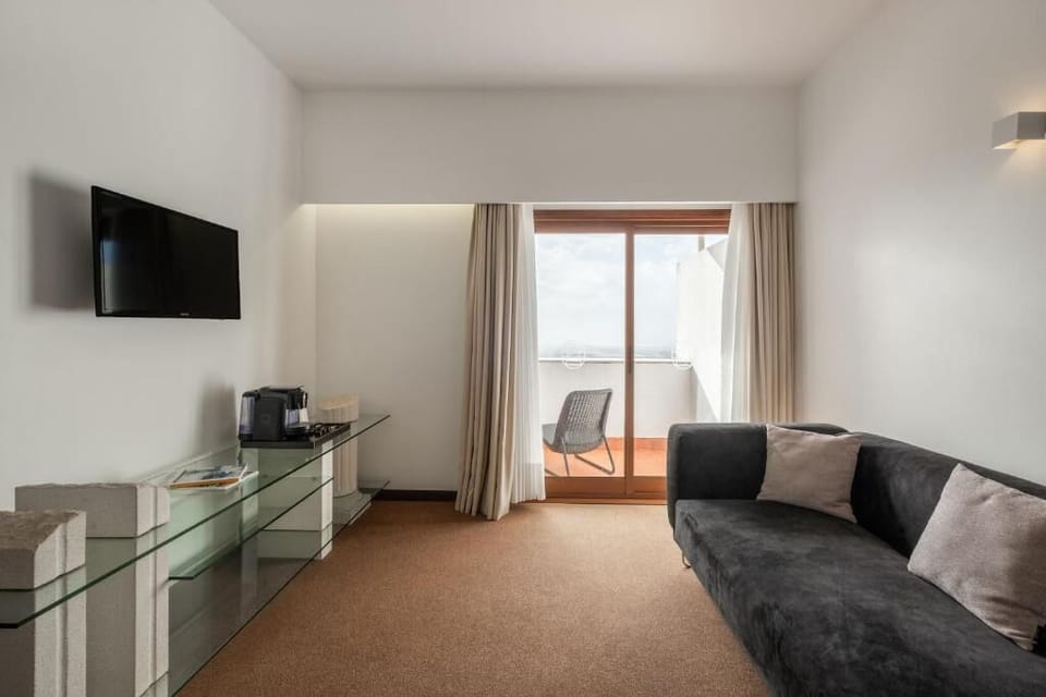Superior Double Room, Balcony | Living area | 50-cm TV with cable channels
