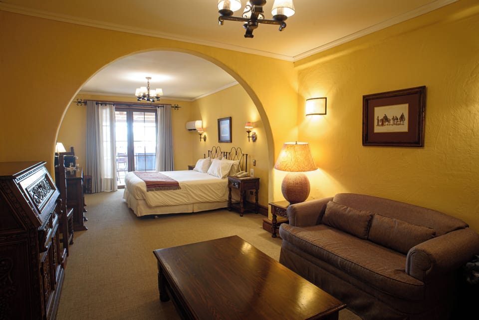 Deluxe Suite, 1 King Bed | Minibar, in-room safe, desk, blackout drapes