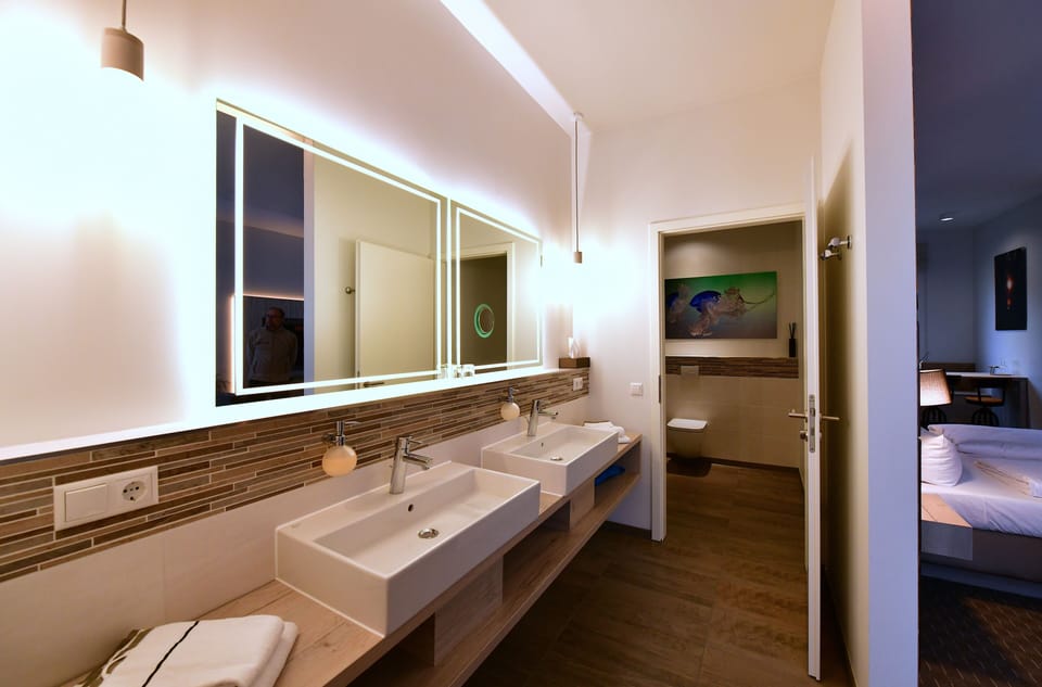 Junior Suite, 1 Bedroom | Bathroom | Shower, rainfall showerhead, free toiletries, hair dryer