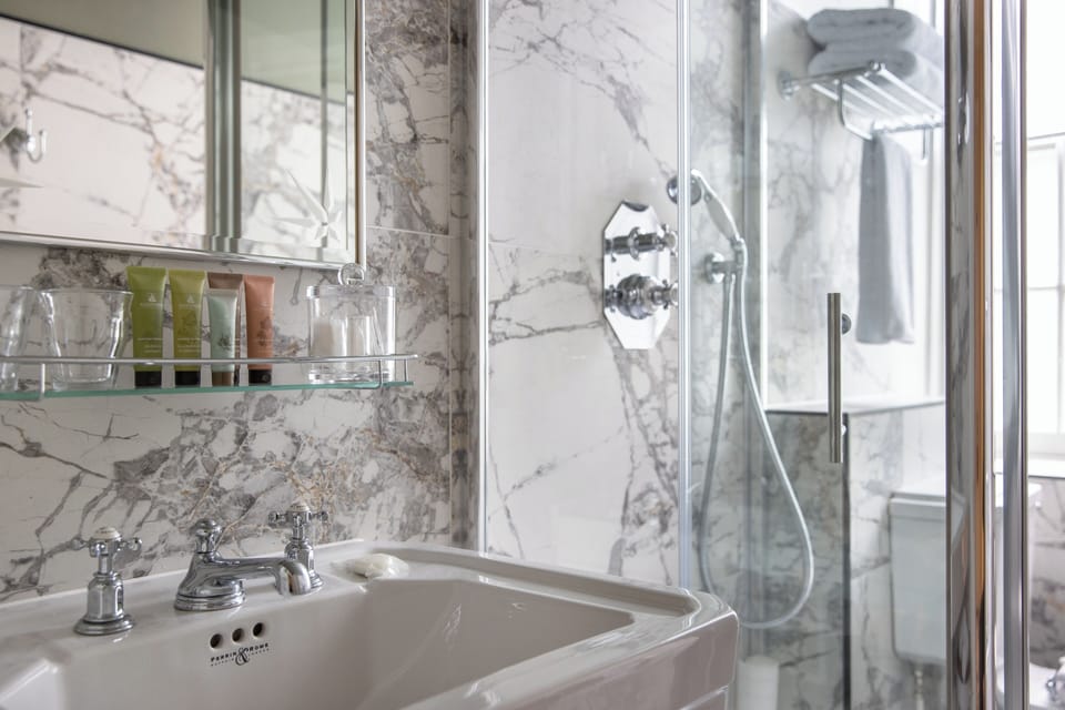 Family | Bathroom | Shower, designer toiletries, hair dryer, bathrobes