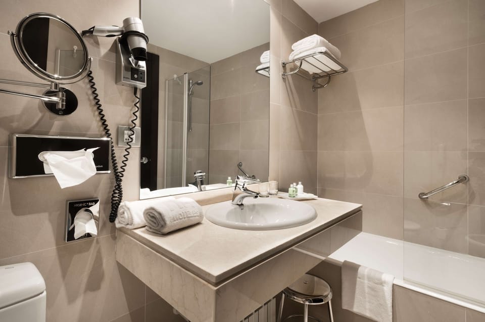 Eco-friendly toiletries, hair dryer, towels