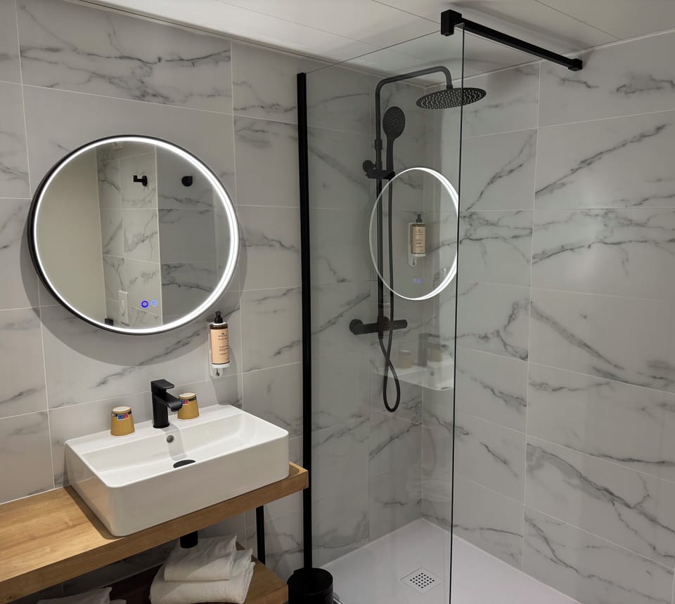 Shower, eco-friendly toiletries, hair dryer, towels