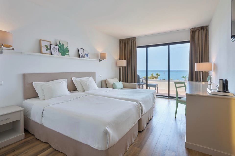 Classic Double or Twin Room, Sea View | Minibar, in-room safe, desk, blackout drapes
