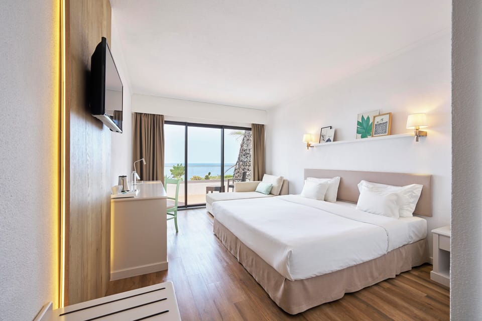 Superior Double or Twin Room, Sea View | Minibar, in-room safe, desk, blackout drapes