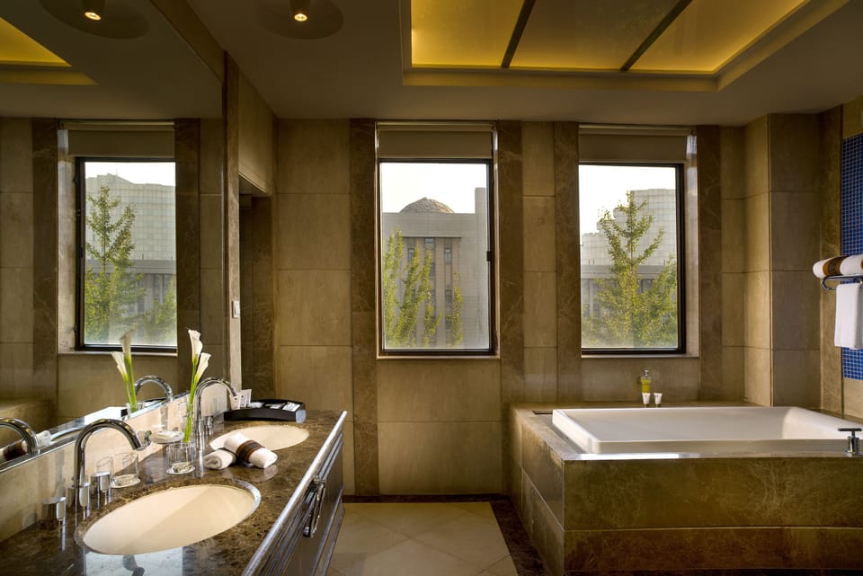 Separate tub and shower, designer toiletries, hair dryer, bathrobes