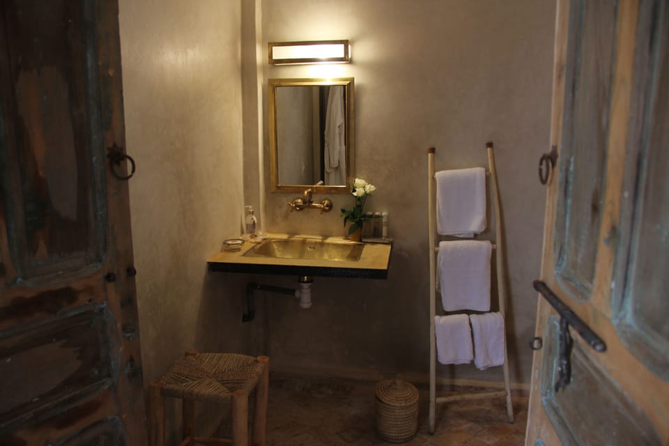 Superior Suite, 2 Bedrooms | Bathroom | Shower, rainfall showerhead, bathrobes, towels