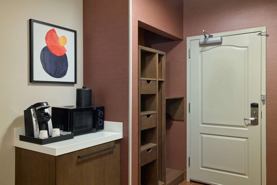 Desk, laptop workspace, blackout drapes, iron/ironing board