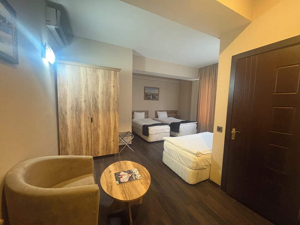 Standard Triple Room | Premium bedding, in-room safe, desk, blackout drapes