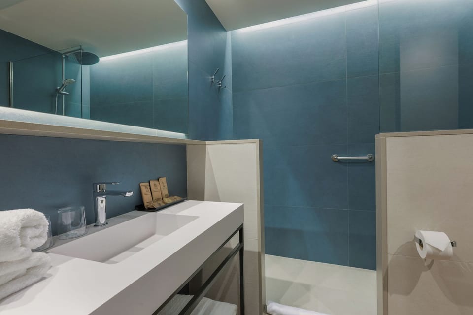 Shower, rainfall showerhead, eco-friendly toiletries, hair dryer