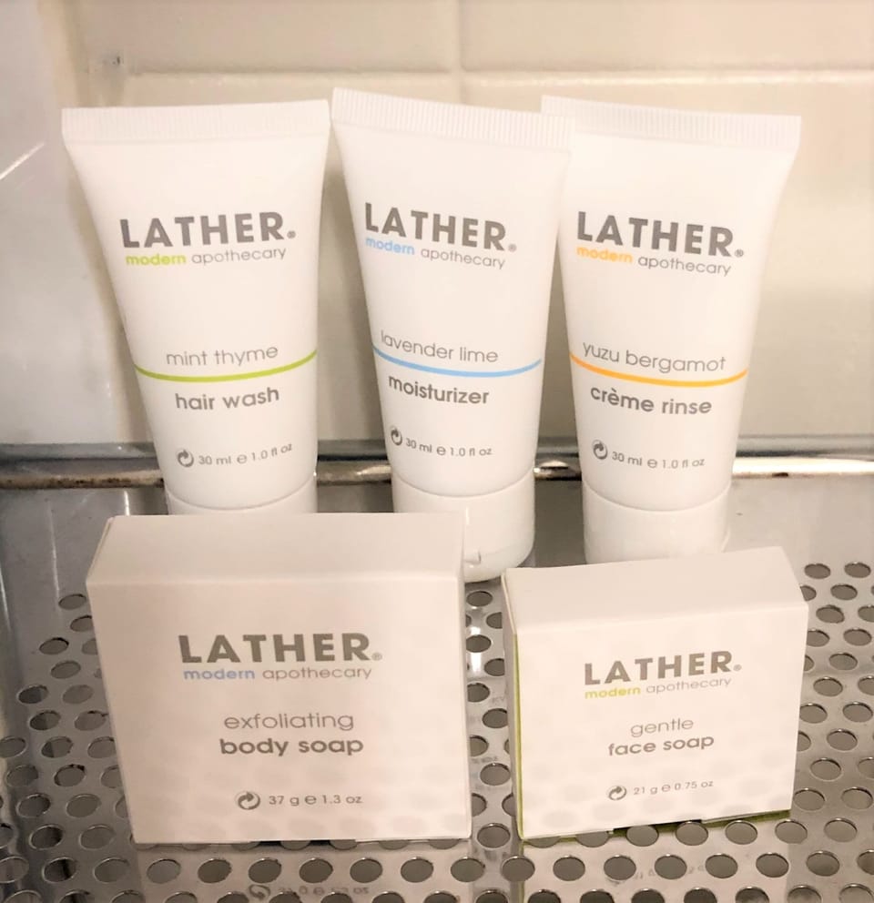 Shower, designer toiletries, hair dryer, bathrobes