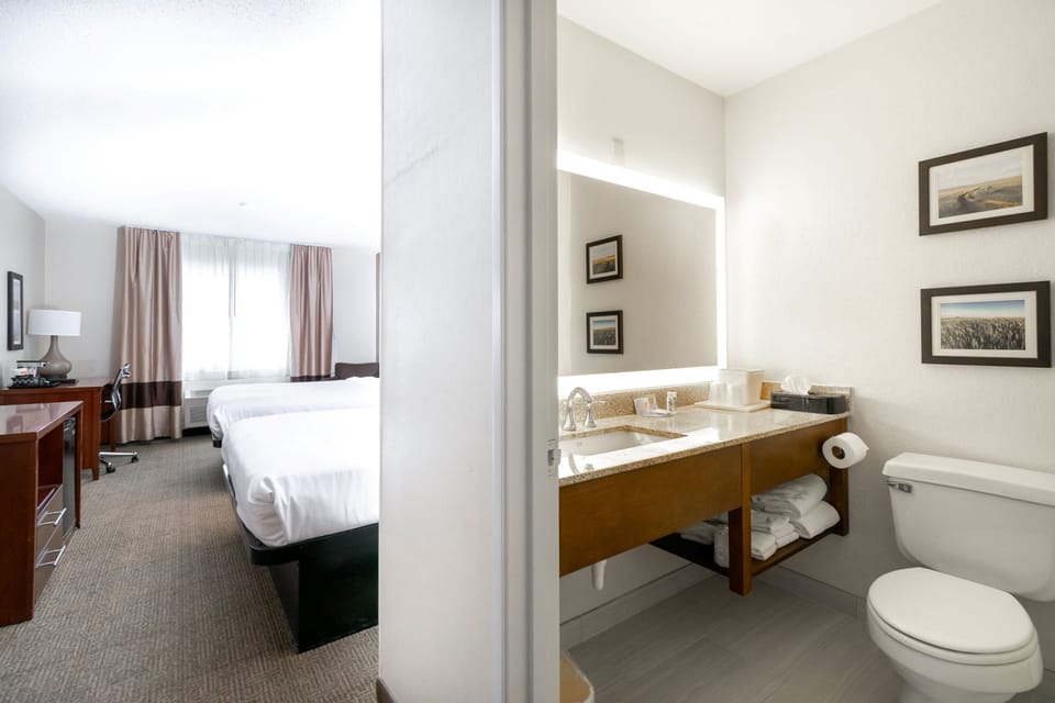 Standard Room, 2 Queen Beds, Non Smoking | Bathroom | Combined shower/tub, free toiletries, hair dryer, towels
