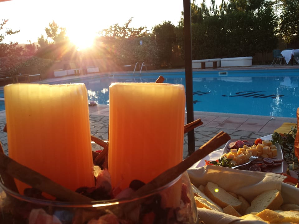 Seasonal outdoor pool, open 9:00 AM to 7:00 PM, pool umbrellas