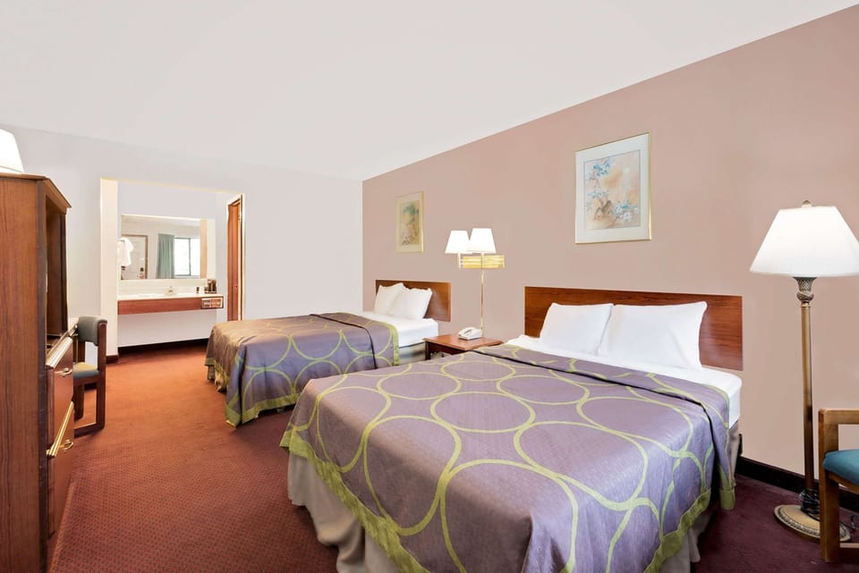 Room, 2 Queen Beds, Non Smoking | Individually decorated, individually furnished, desk, blackout drapes