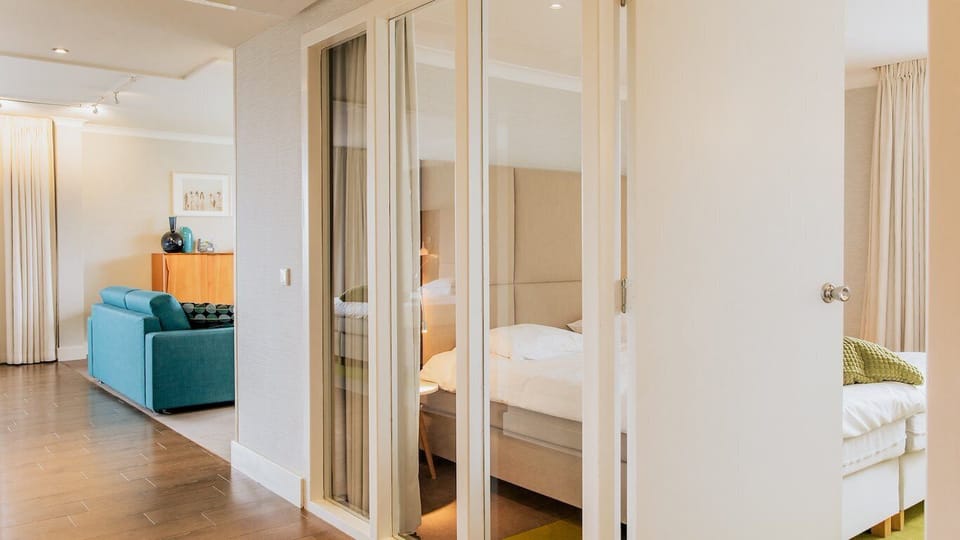 Apartment 120 with bath and balcony | Premium bedding, in-room safe, blackout drapes, iron/ironing board