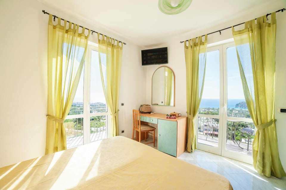 Double or Twin Room, Sea View | In-room safe, desk, WiFi (free), bed sheets