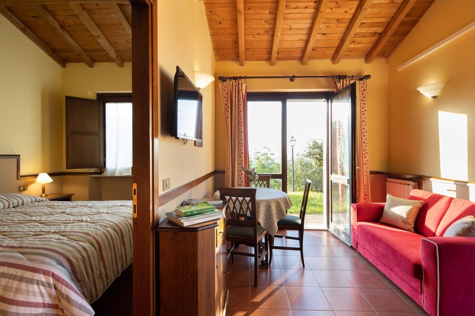 Superior Apartment, 1 Double Bed, Garden Area Situated about 600 meters from the main building | Living area | Flat-screen TV