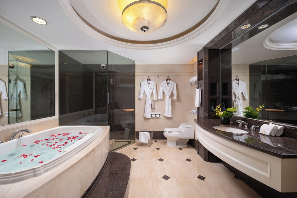 Executive Suite | Bathroom | Shower, hair dryer, slippers, towels