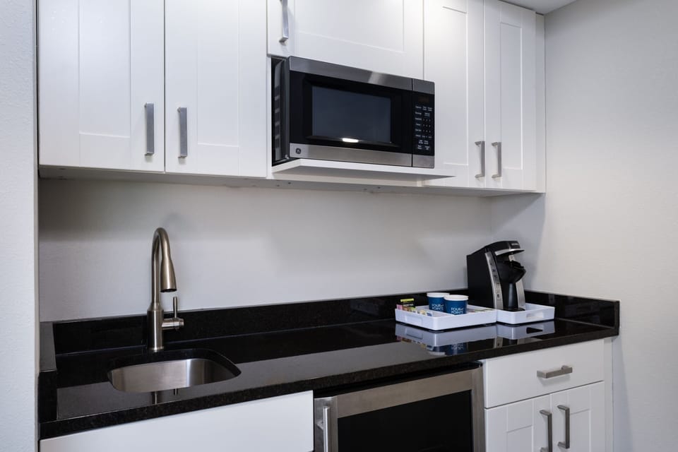 Suite, 1 King Bed, City View (Corner) | Private kitchen | Microwave, coffee/tea maker