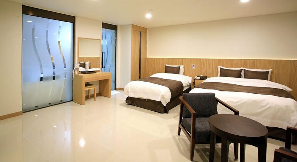 Family Room | Premium bedding, down comforters, free WiFi, bed sheets