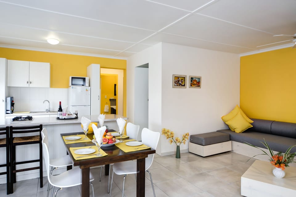 Family Cottage, 2 Bedrooms, Garden Area | Living area | 32-inch flat-screen TV with digital channels, TV, books