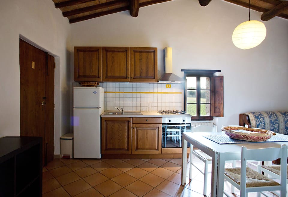 Apartment, 1 Bedroom, Ground Floor (Il Campo) | Private kitchen | Full-size fridge, coffee/tea maker